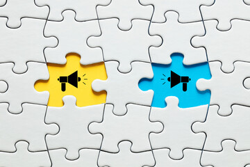 Fototapeta premium Missing puzzle pieces with megaphone icons. Communication, discussion, chatting, conversation, argument or negotiation