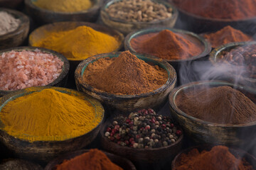 Colorful spices in bowl background