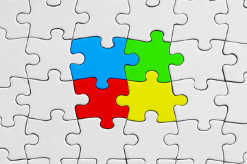 Colorful jigsaw puzzle pieces stand out from the crowd. Diversity, unity, cooperation or interaction