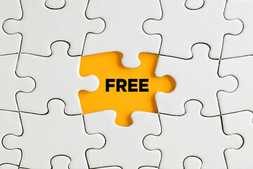 The word free on yellow missing puzzle piece. Free of charge offer, product or service