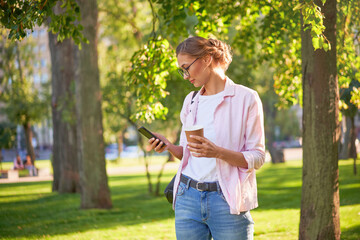 Businesswoman standing summer park Business person