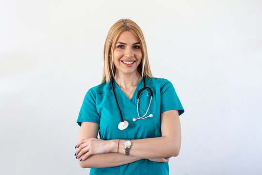 Beautiful young female medical doctor is looking at camera and smiling Shot of a female doctor standing confidently with her arms crossed