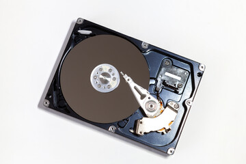 Opened hard drive disc, isolated on white background