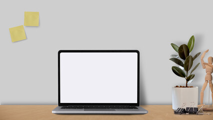 Fototapeta premium Mock up laptop computer with blank white screen on wooden desk with designer style concept.