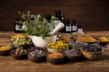 Natural medicine and mortar, healing herbs background