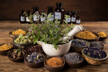 Natural medicine and mortar, healing herbs background