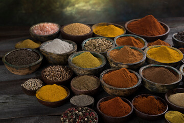 Spices and herbs selection on wooden background