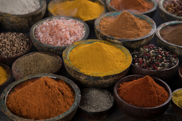 Spices on wooden bowl background