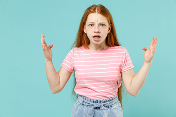 Little indignant angry expressive confused redhead kid girl 12-13 years old in pink striped t-shirt...