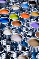Group of tin metal cans with color paint