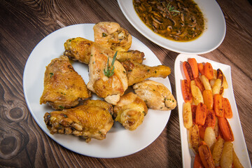 Chicken Hunter recipe with glazed root vegetables, carrot, turnip with its mushroom sauce deglazed in white wine and wet with the chicken stock