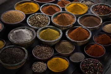 Spices and herbs selection on wooden background