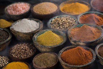 Spices and herbs selection on wooden background