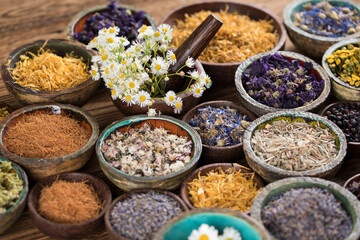 Natural medicine and mortar, healing herbs background