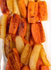 Chicken Hunter recipe with glazed root vegetables, carrot, turnip with its mushroom sauce deglazed in white wine and wet with the chicken stock