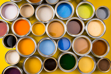 Buckets full of rainbow colored oil paint