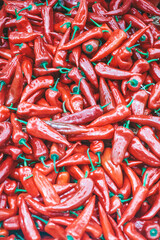 Paprika pepper background. Fresh sweet red paprika peppers on the counter of the vegetable market