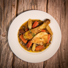 Chicken Hunter recipe with glazed root vegetables, carrot, turnip with its mushroom sauce deglazed in white wine and wet with the chicken stock