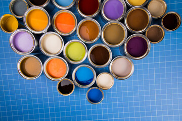 Full Buckets of rainbow colored oil paint