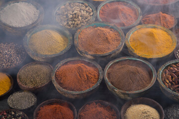 Spices and herbs in wooden bowl Colorful spices