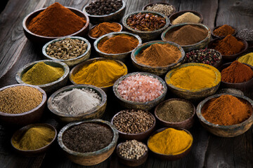 Colorful spices in bowl background