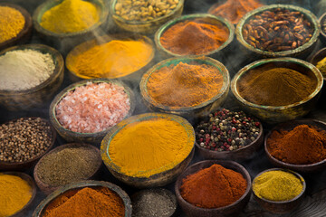 Aromatic spices on wooden background