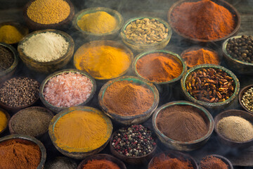 Aromatic spices on wooden background