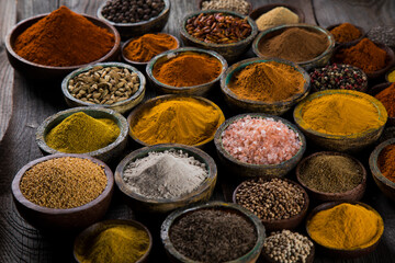 Aromatic spices on wooden background