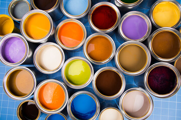 Full Buckets of rainbow colored oil paint
