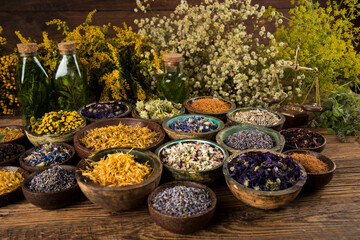 Natural remedy and mortar, healing herbs background