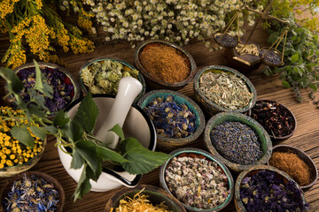 Natural medicine and mortar, healing herbs background