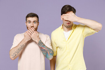 Young shocked surprised scared sad men friends together wearing casual t-shirt tattoo translate fun...