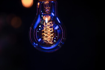 Close up of a glowing lamp in the dark copy space.