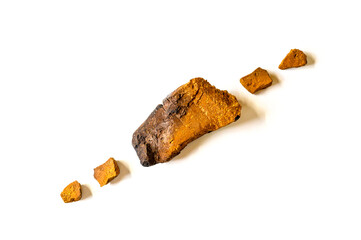 chaga mushroom. broken pieces of birch tree chaga fungus for brewing natural medicinal antitumor, anti-inflammatory and antiviral detox tea, isolation on white background