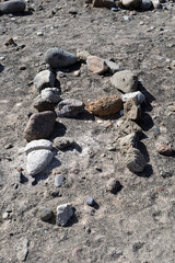 Letter A in Stones on Sandy Beach 6160-3187-036