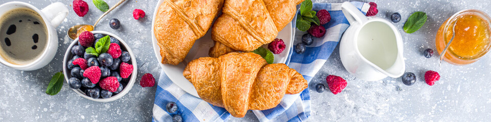 Sweet breakfast croissants with jam and berries