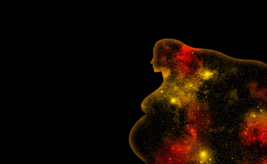 Yellow and red shining universe in the shape of a pregnant woman on a black background