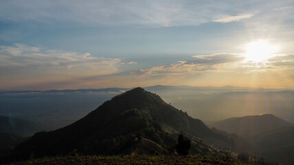 View of the mountain peak and the sky and the sun. Nan Province in Thailand