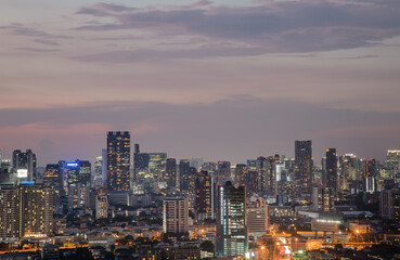 Fototapeta na wymiar Bangkok, Thailand - May 09, 2021: Aerial view of Beautiful scenery view of Skyscraper Evening time Sunset creates relaxing feeling for the rest of the day. Selective focus.