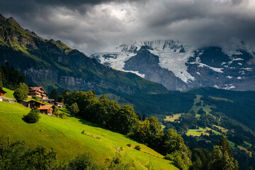 Naklejka premium Scenic surroundings near the alpine resort Wengen. Location place Swiss alp, Lauterbrunnen valley.