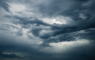 Obraz premium Tropical ominous clouds in front of the hurricane. Photo of the texture of storm clouds.