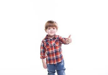 Little boy in plaid shirt thumb up isolated