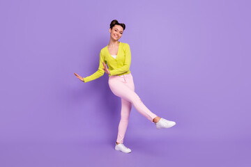 Fototapeta na wymiar Full length body size photo of woman with girlish hairstyle spending free time on discotheque isolated on pastel purple color background