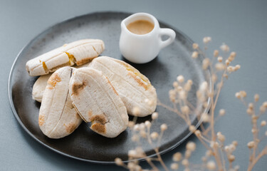 homemade grilled banana with coconut milk sauce