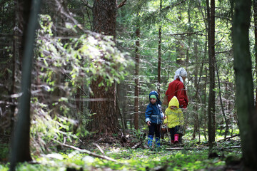 Children go to the forest for mushrooms © alexkich