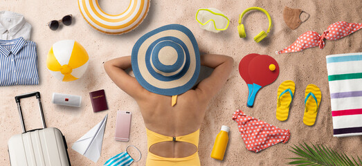 Obraz premium Flat lay top and rear view of young woman with travel essentials, summer holiday concept.