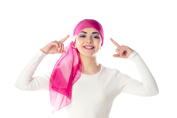 Young brunette woman wearing pink head scarf