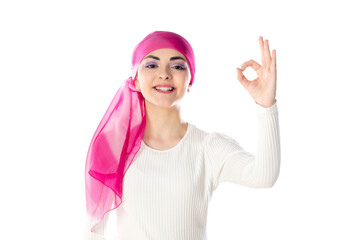 Obraz na płótnie Canvas Young brunette woman wearing pink head scarf