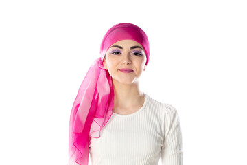 Young brunette woman wearing pink head scarf