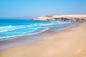 Moroccan beach with fresh hot sand in the summertime on the coast of Morocco in Africa - obrazy, fototapety, plakaty